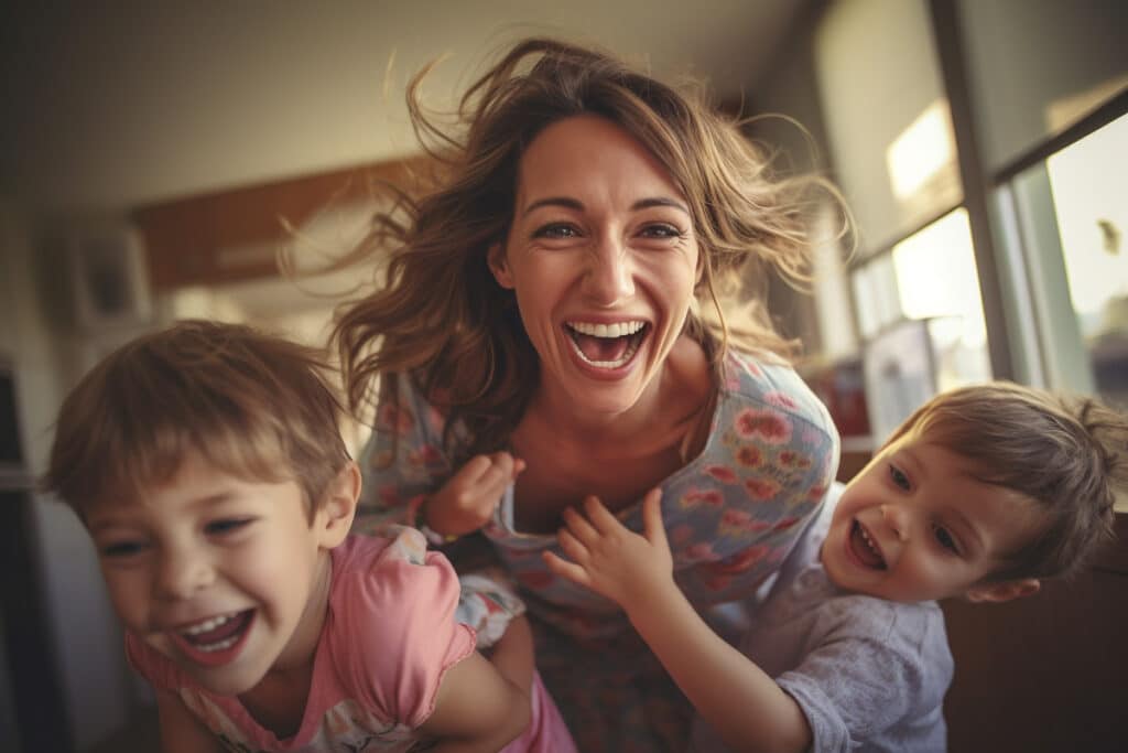 a plyafull moment of mom with her sons