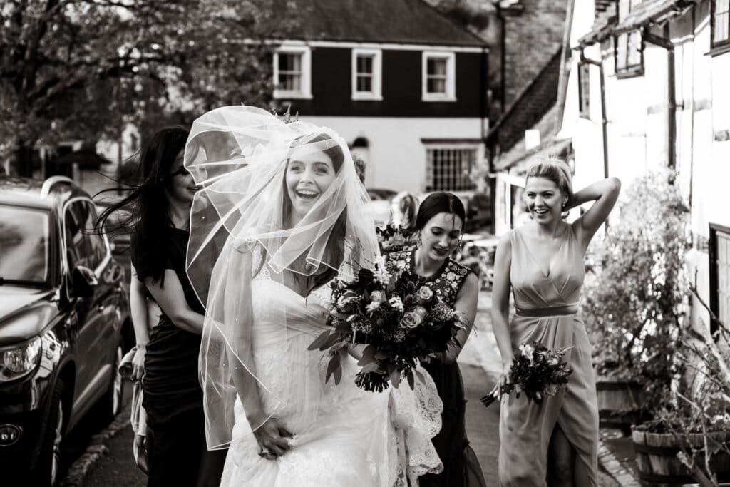 documentary wedding shoot of a bride with holding flowers in her hand