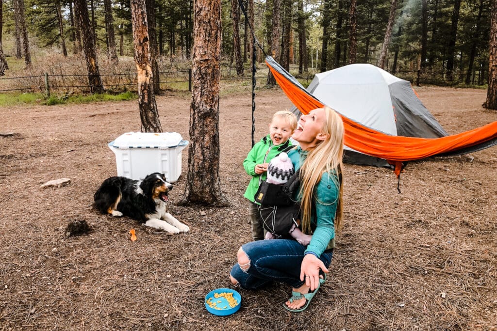 mom and son having playful time at the camp side