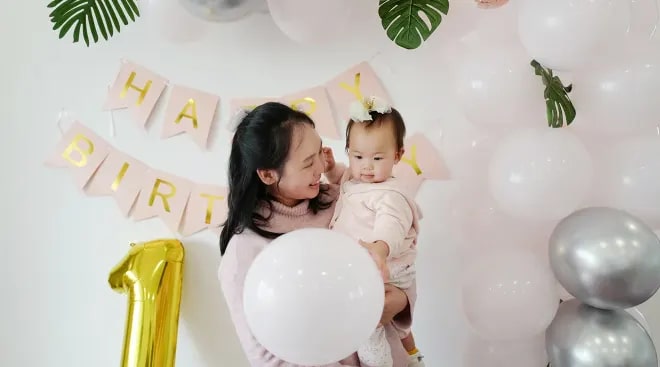 mom celebrating her sons birthday captured in a camera