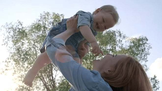 mom-holding-her-son-captured-in-a-camera