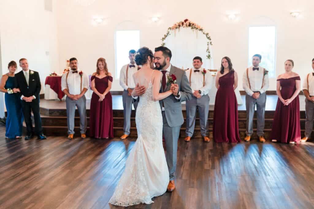 bride and groom dancing guests gathered aroud