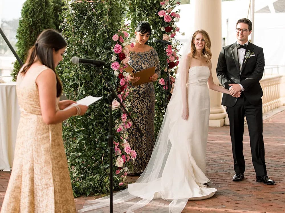 ceremony moments captured bride and groom holding hands bridesmaid giving speech