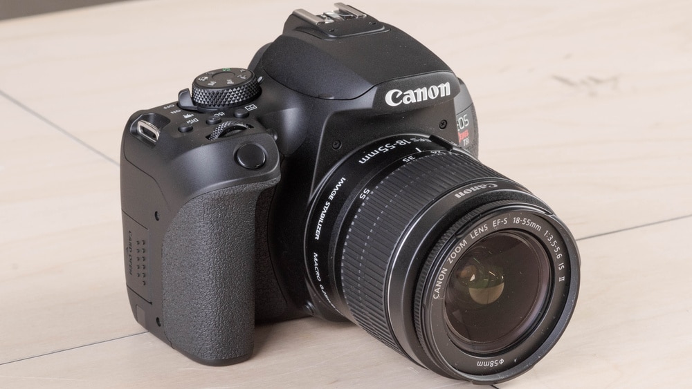 canon T i camera placed on a surface