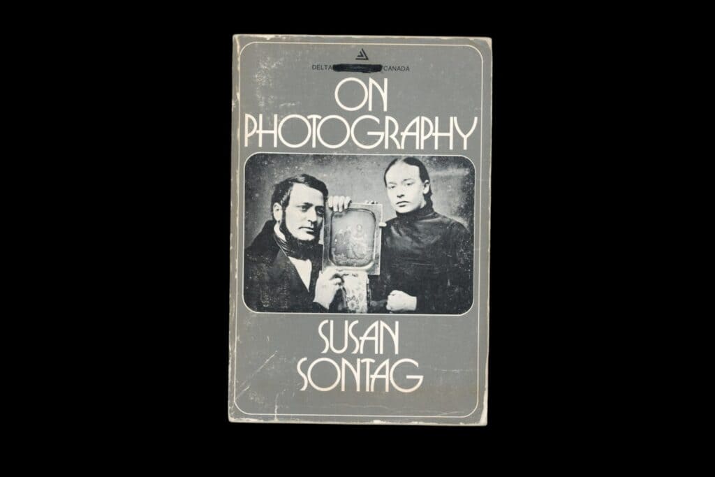 on photography book in front of a black background