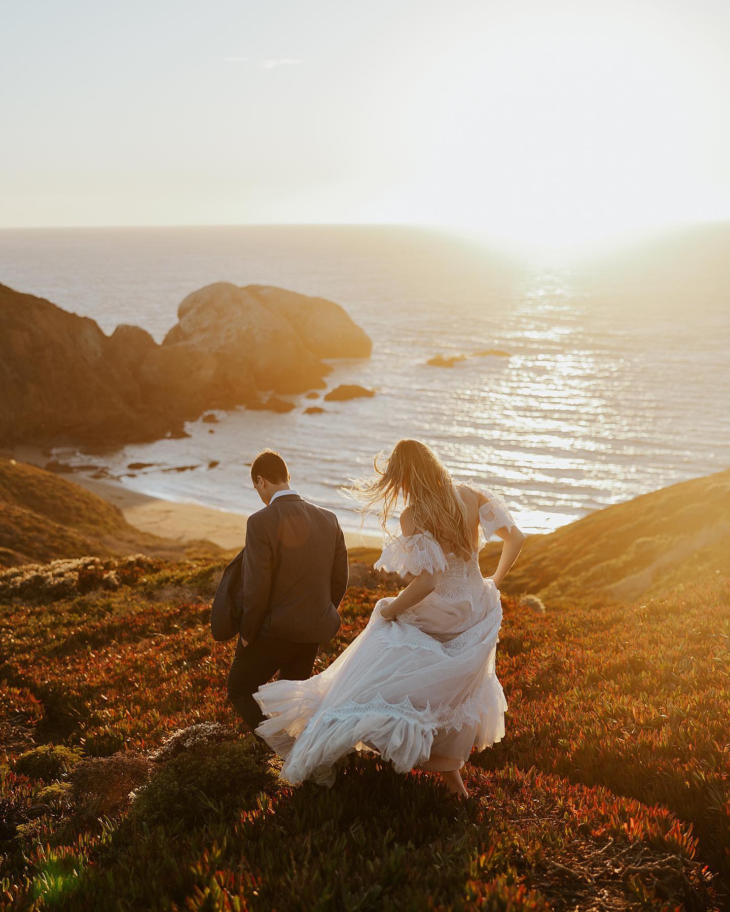 bride and groom's back captured during golden hour