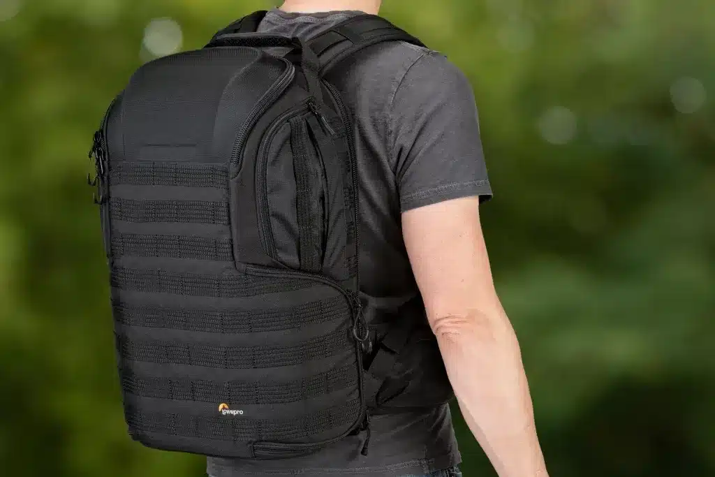 close up of a male wearing black lowepro backpack