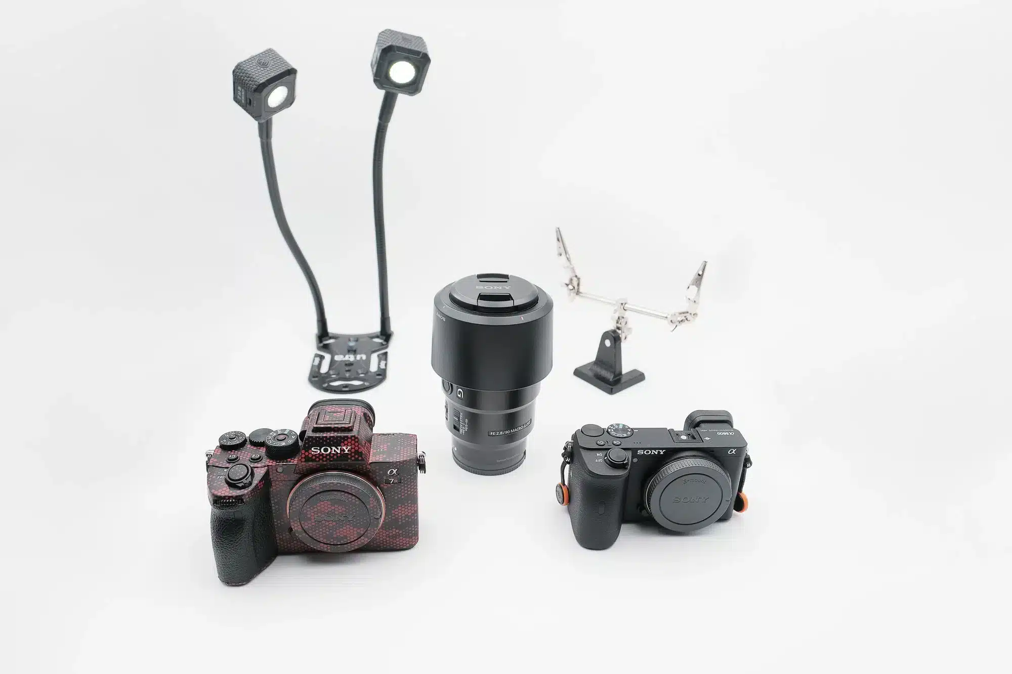 kit for macro photography camera lighting lens in front of a simple white background