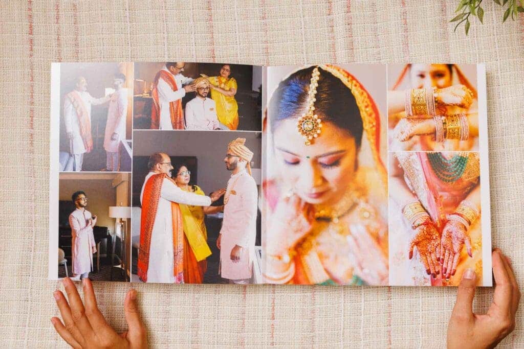 zoomed in view of hands holding the indian wedding album