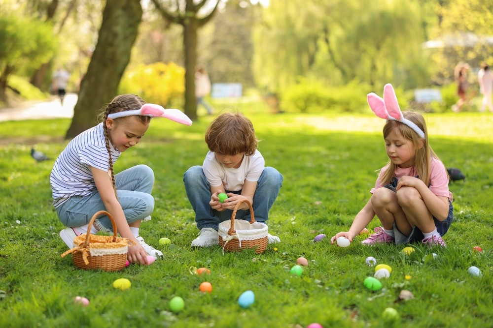 Cute Little Children Hunting Eggs Outdoors