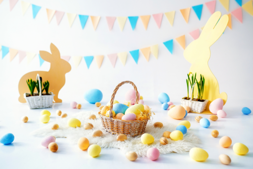 Many colorful Easter eggs with bunnies and baskets Easter decoration of the room