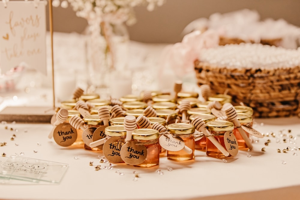 Wedding Favors Of Little Jars Of Honey And A Sign