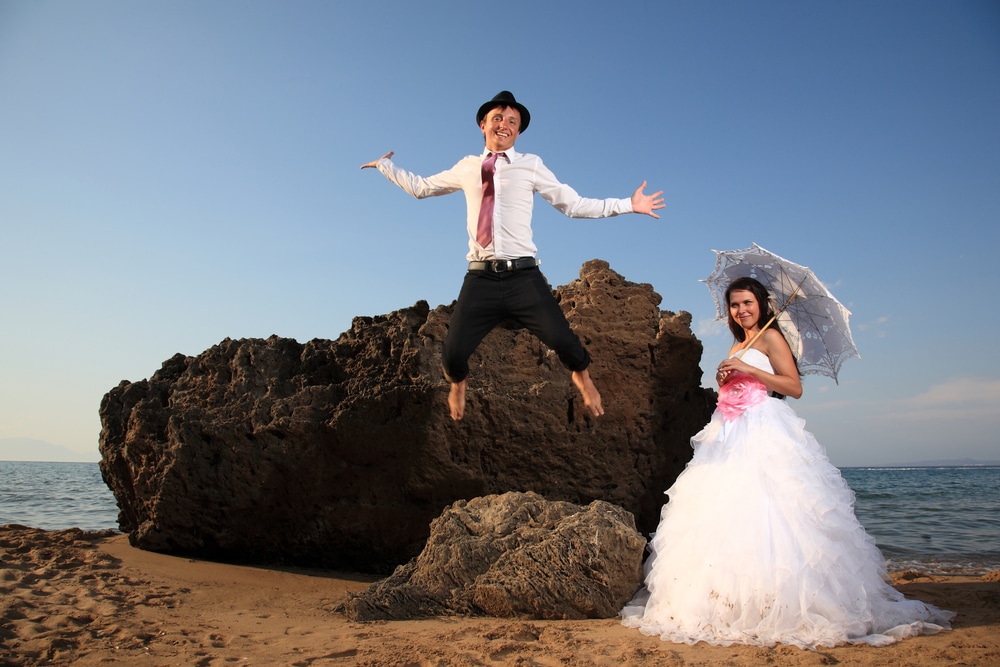 Portrait Of A Beautiful Bride And Groom At The Beach