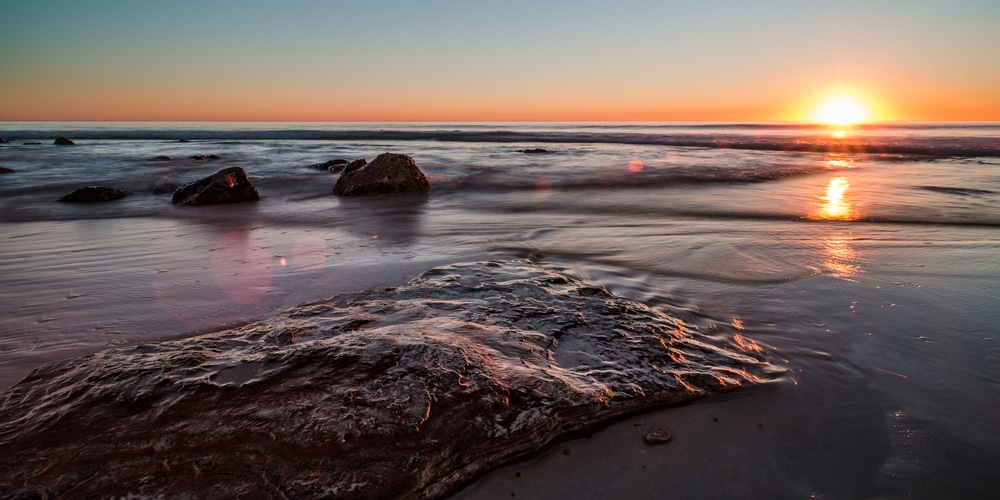 Sunrise at the beach with low tide and low exposure